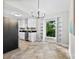 Well-lit kitchen features white cabinets, stainless steel appliances, granite countertops, and built-in shelving at 430 Queens Rd # 332, Charlotte, NC 28207