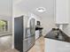 Updated kitchen features stainless steel appliances, granite counters, white cabinets, and modern fixtures at 430 Queens Rd # 332, Charlotte, NC 28207