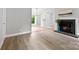 Living room with fireplace, light-colored walls and luxury vinyl plank at 430 Queens Rd # 332, Charlotte, NC 28207