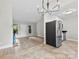 Open-concept living area features wood-look flooring, stainless steel appliances, and ample natural light at 430 Queens Rd # 332, Charlotte, NC 28207