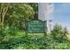 Community sign nestled among lush landscaping at 430 Queens Rd # 332, Charlotte, NC 28207