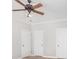 Clean bedroom with carpet flooring, a ceiling fan, neutral walls, and white doors at 4504 Sages Ave, Indian Trail, NC 28079