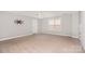 Neutral bedroom features carpet, ceiling fan, window, and a pre-installed TV mount at 4504 Sages Ave, Indian Trail, NC 28079