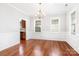 Formal dining room featuring hardwood floors, decorative molding, and elegant chandelier lighting at 4504 Sages Ave, Indian Trail, NC 28079