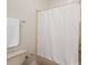 Bathroom featuring a shower with a white curtain, toilet, and towel rack at 608 Camrose Ne Cir, Concord, NC 28025