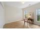 Bright bedroom with light hardwood floors, closet, and natural light from two windows at 608 Camrose Ne Cir, Concord, NC 28025