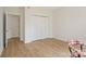 Bedroom features hardwood floors, closet with bifold doors and fresh paint at 608 Camrose Ne Cir, Concord, NC 28025