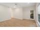 Bedroom with neutral walls and laminate flooring and a door leading to the exterior at 608 Camrose Ne Cir, Concord, NC 28025