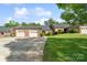 Charming single-story brick home with well-maintained landscaping, driveway, and attached two-car garage at 608 Camrose Ne Cir, Concord, NC 28025