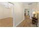 Open foyer with hardwood floors leading to a dining room and other living spaces at 608 Camrose Ne Cir, Concord, NC 28025