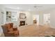 Bright living room featuring a fireplace, built-in shelving, and comfortable seating at 608 Camrose Ne Cir, Concord, NC 28025