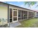 Exterior angle of the screened in porch featuring a ceiling fan and furniture inside at 608 Camrose Ne Cir, Concord, NC 28025