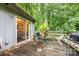 Outdoor deck featuring seating and a grill perfect for entertaining amidst lush greenery at 610 N Shaver St # 14, Salisbury, NC 28144