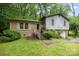 Split level home with a brick and gray wood facade and attached one car garage at 610 N Shaver St # 14, Salisbury, NC 28144
