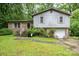 Split level home with a brick and gray wood facade and attached one car garage at 610 N Shaver St # 14, Salisbury, NC 28144