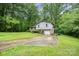 Split level home surrounded by lush greenery and mature trees, offering privacy and shade at 610 N Shaver St # 14, Salisbury, NC 28144