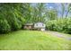 Split level home surrounded by lush greenery and mature trees, offering privacy and shade at 610 N Shaver St # 14, Salisbury, NC 28144