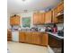 Functional kitchen featuring wood cabinets, white appliances, and ample counter space at 610 N Shaver St # 14, Salisbury, NC 28144
