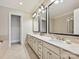 Elegant bathroom featuring a double vanity with granite countertops, modern fixtures, and plenty of cabinet space at 6128 Fletcher Cir, Charlotte, NC 28226