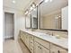 Elegant bathroom featuring a double vanity with granite countertops, modern fixtures, and plenty of cabinet space at 6128 Fletcher Cir, Charlotte, NC 28226