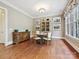 Formal dining room featuring hardwood floors, natural lighting, and elegant furnishings at 6128 Fletcher Cir, Charlotte, NC 28226