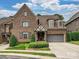 Charming brick home with a well-manicured front yard and a two-car garage, offering curb appeal at 6128 Fletcher Cir, Charlotte, NC 28226