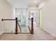Upstairs hallway featuring carpet runner and eye-catching art at 6128 Fletcher Cir, Charlotte, NC 28226