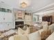 Cozy living area features fireplace, built-in shelves, and abundant natural light at 6128 Fletcher Cir, Charlotte, NC 28226