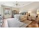 Serene main bedroom with hardwood flooring, a ceiling fan, and soft decor at 6128 Fletcher Cir, Charlotte, NC 28226