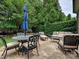 Outdoor patio with furniture and a blue umbrella at 6128 Fletcher Cir, Charlotte, NC 28226