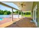 Spacious back porch with a ceiling fan overlooking the backyard and pool area at 752 Chipmeadow Ln, York, SC 29745