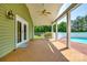Inviting back porch with a ceiling fan overlooking the deck and pool at 752 Chipmeadow Ln, York, SC 29745