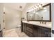 Bathroom with double vanity and dark wood cabinets with tile floor at 752 Chipmeadow Ln, York, SC 29745