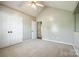 Carpeted bedroom offering ample closet space with ceiling fan and light at 752 Chipmeadow Ln, York, SC 29745