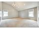 Spacious bedroom with vaulted ceiling, chandelier, and two windows at 752 Chipmeadow Ln, York, SC 29745