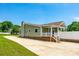 Charming home with a covered porch, white railing, and a spacious driveway at 752 Chipmeadow Ln, York, SC 29745