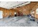 An empty two car garage with exposed wood and a concrete floor at 752 Chipmeadow Ln, York, SC 29745