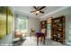 Cozy home office with large window, bookshelves, and comfortable seating at 107 Asmodean Ln, Troutman, NC 28166