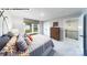 Bedroom with a queen bed, a window with backyard view, and staircase access to the upper level at 109 Asmodean Ln, Troutman, NC 28166
