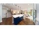 Open-concept kitchen featuring a large island, modern appliances, and seamless flow to living spaces at 109 Asmodean Ln, Troutman, NC 28166
