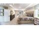A bright main bedroom suite offers tray ceilings, large windows, and an en-suite bathroom at 109 Asmodean Ln, Troutman, NC 28166