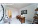 The home office features neutral carpeting, a desk, and views of the neighborhood at 109 Asmodean Ln, Troutman, NC 28166