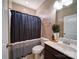 Cozy bathroom featuring a shower with a striped curtain and decorative plants at 120 Autumn Mist Rd, Statesville, NC 28677