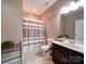 Bathroom featuring gray striped shower curtain, vanity and tile flooring at 120 Autumn Mist Rd, Statesville, NC 28677