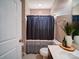 Cozy bathroom featuring a shower with a striped curtain and modern fixtures at 120 Autumn Mist Rd, Statesville, NC 28677