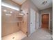 Bathroom features a walk in shower with glass door and tile surround at 120 Autumn Mist Rd, Statesville, NC 28677