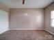 Empty bedroom showcasing neutral paint, carpeting, and natural light at 120 Autumn Mist Rd, Statesville, NC 28677