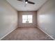 Neutral bedroom featuring carpet, ceiling fan, and window at 120 Autumn Mist Rd, Statesville, NC 28677