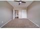 Neutral bedroom with carpet floors, ceiling fan, and white trim at 120 Autumn Mist Rd, Statesville, NC 28677