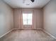 Comfortable bedroom featuring a ceiling fan and bright, natural light from the window at 120 Autumn Mist Rd, Statesville, NC 28677